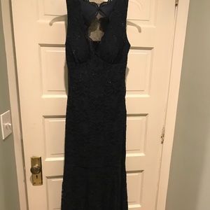 Beautiful floor length lace keyhole trumpet gown.